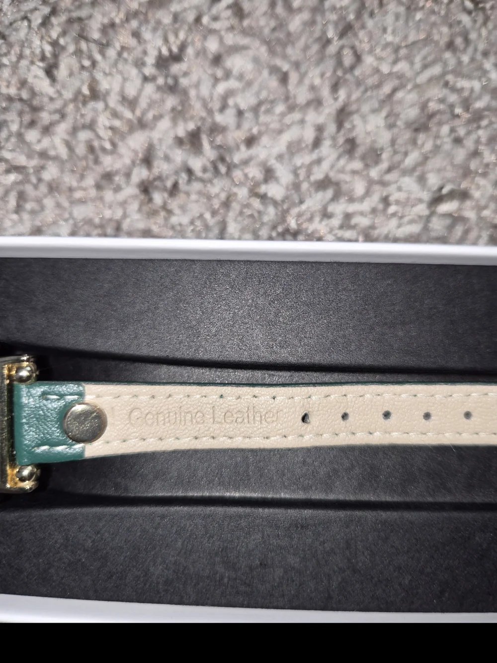 Samsung Galaxy Watch FE with Green Leather Strap and Gold Accents